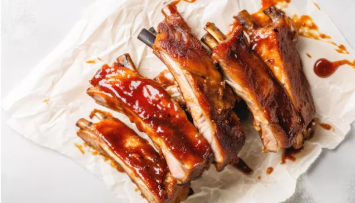Add barbecue sauce to ribs after cooking